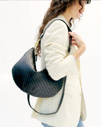 Model carrying the Black Woven Zig Zag Moyen Mesenger. 