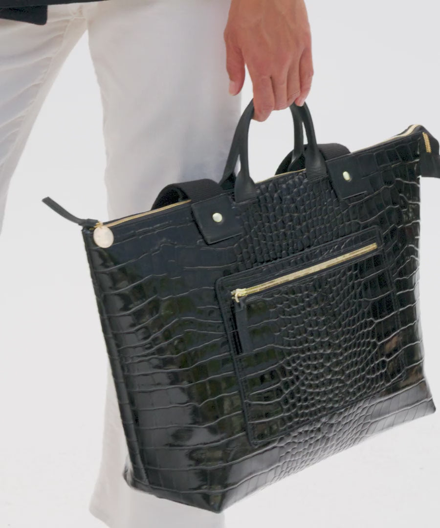 Model carrying the Black Croco Le Zip Sac.