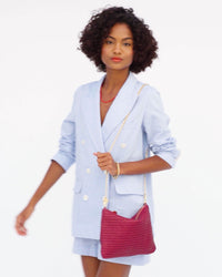 Vitoria wears the Plummy Flat Clutch with the Le Story Crossbody Chain