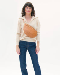 Model carrying the Natural Woven Grande Fanny.