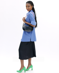 Vitoria wears Lune w Super Red w Studs Shoulder Strap in Video
