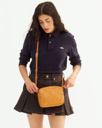 Gia shows how many items fit in her Midi Sac