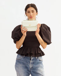 Gia shows how a phone fits in the Kathryn in Mint Box