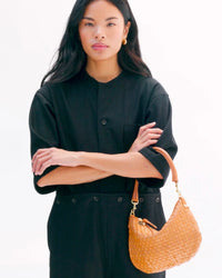 Model carrying the Natural Woven Petit Moyen. 