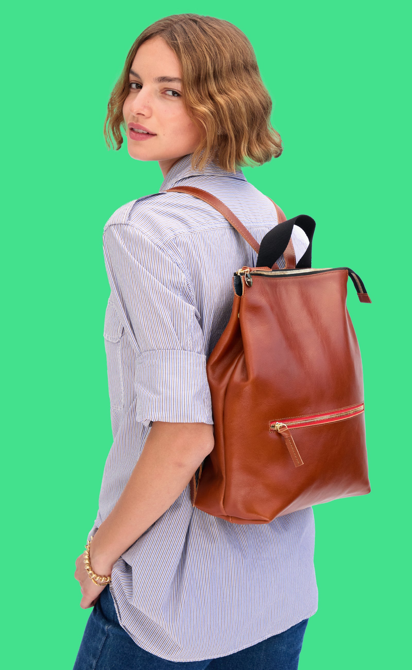 Model carrying the Miel Remi Backpack. 