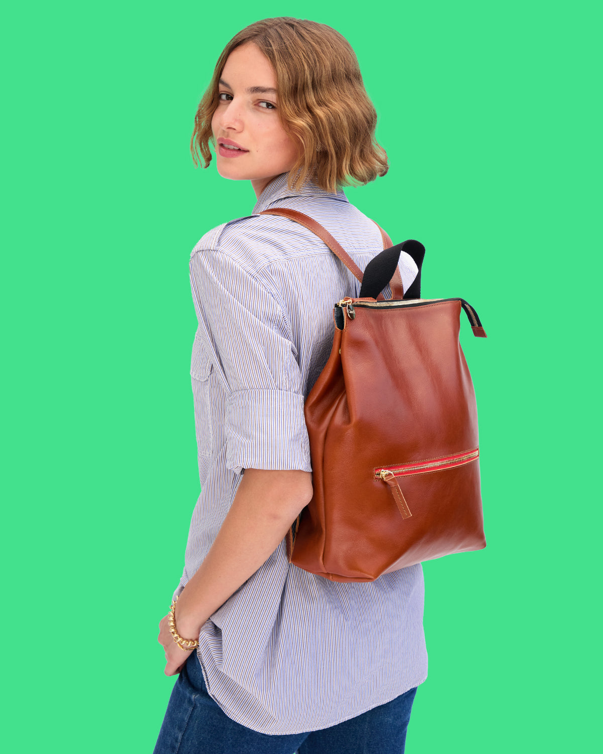 Model carrying the Miel Remi Backpack. 