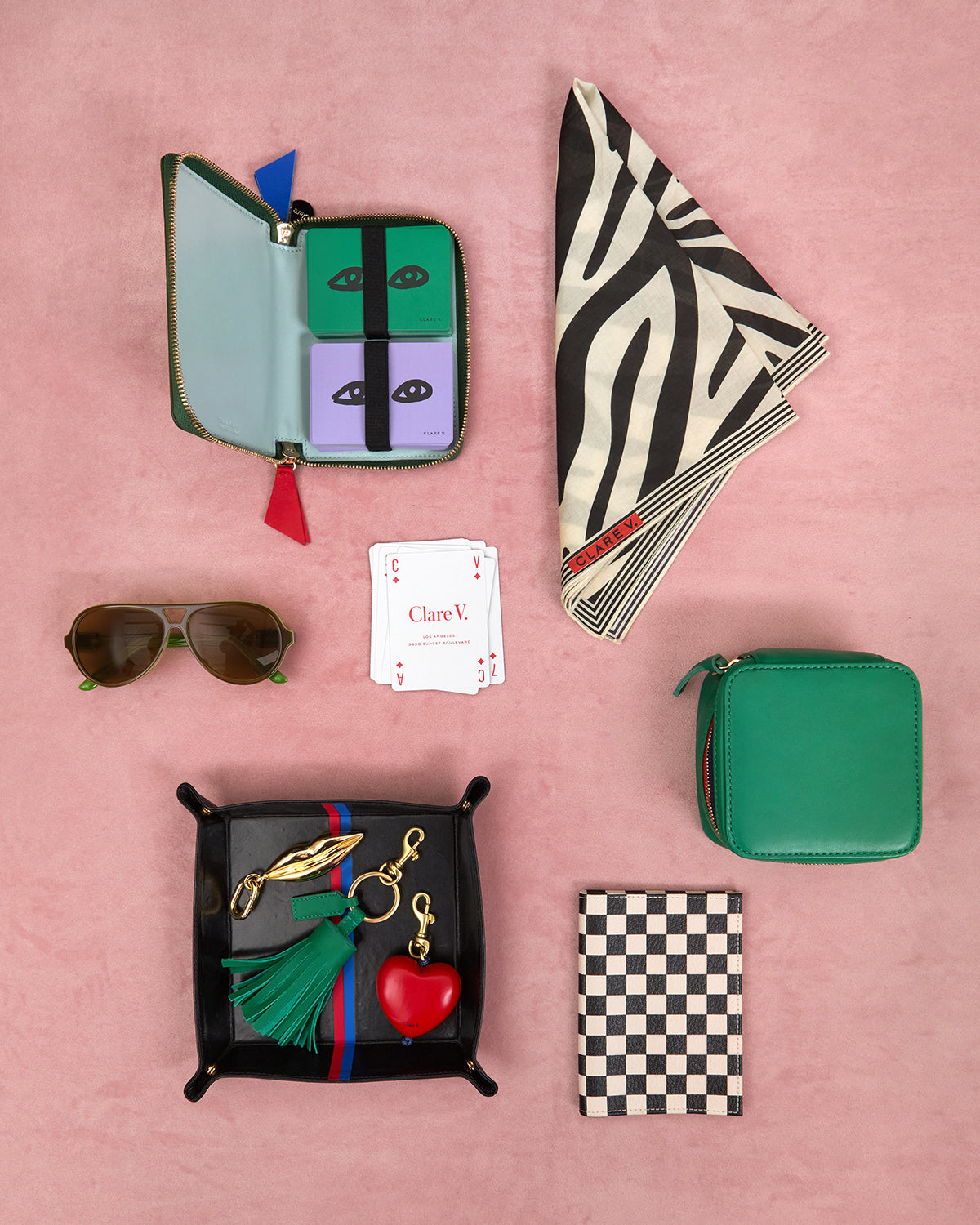 Les Cartes, Sunglasses, Catchall with Bag Fobs inside, Passport Sleeve, Box À Bijoux, and Bandana. 