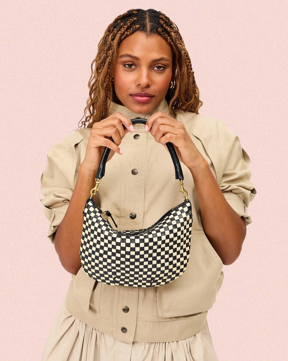 Model holding the Black and Cream Checker Petit Moyen. 