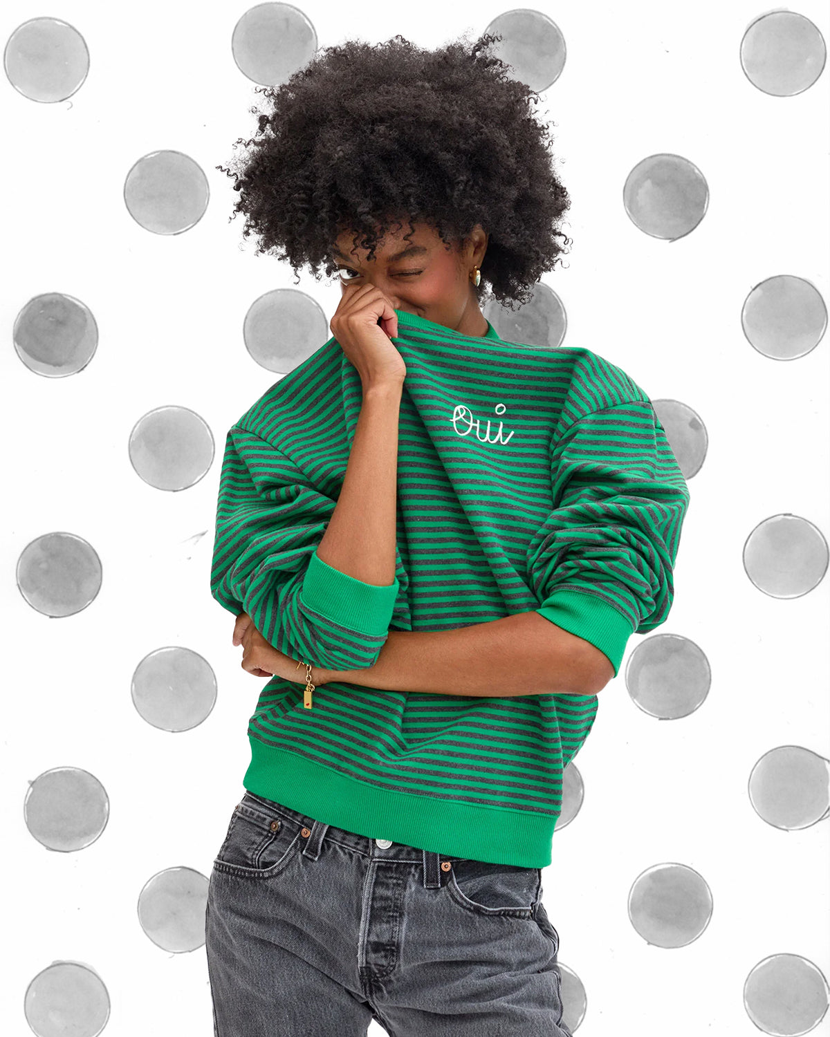 Model wearing the Green with Stripes Oui Oversized Sweatshirt. 
