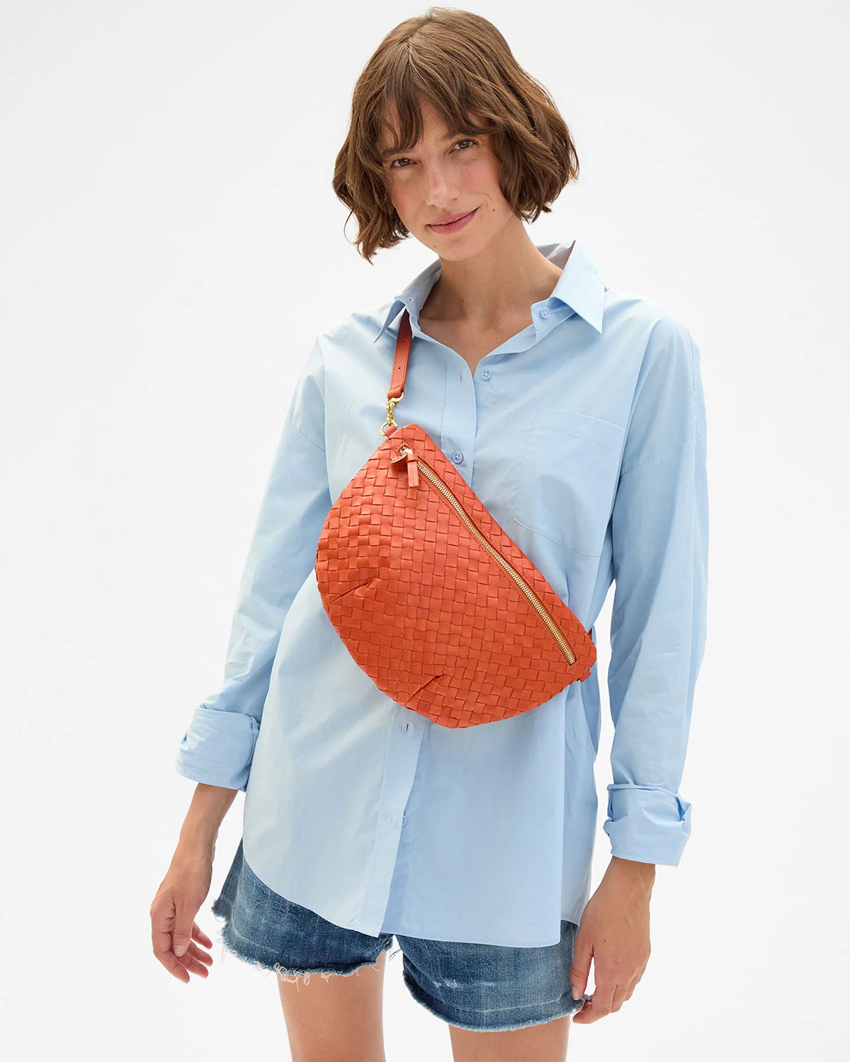 Model carrying the Saltillo Diagonal Woven Grande Fanny across her chest.