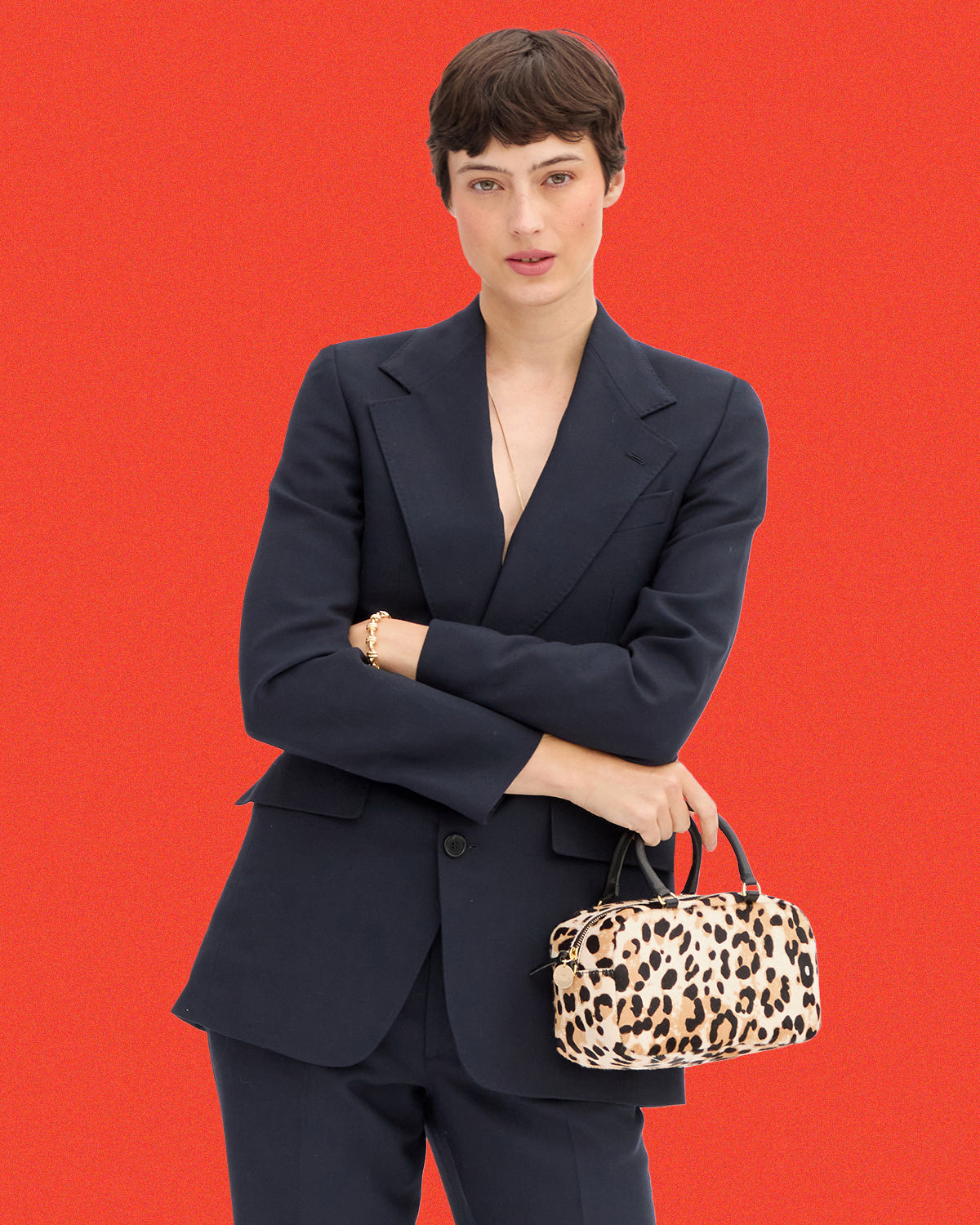 Model carrying the Snow Leopard Hair-On Petite Claudine.