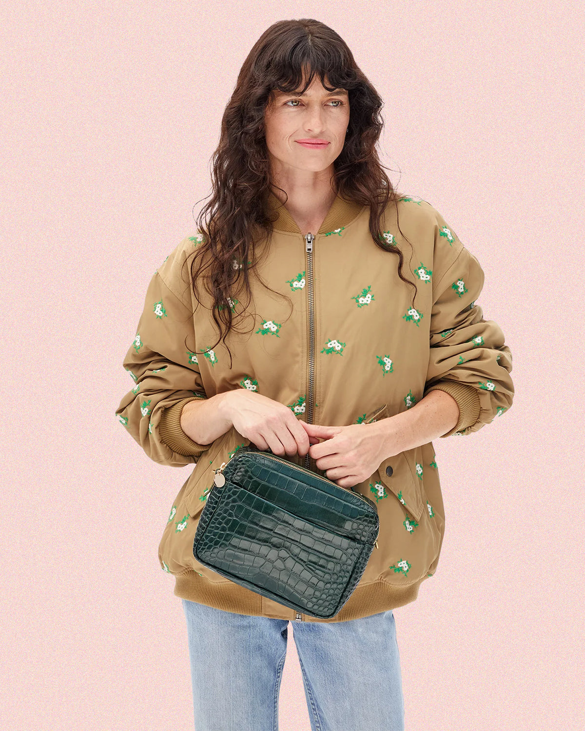Model carrying the Deep Pine Embossed Croco Mirabel.