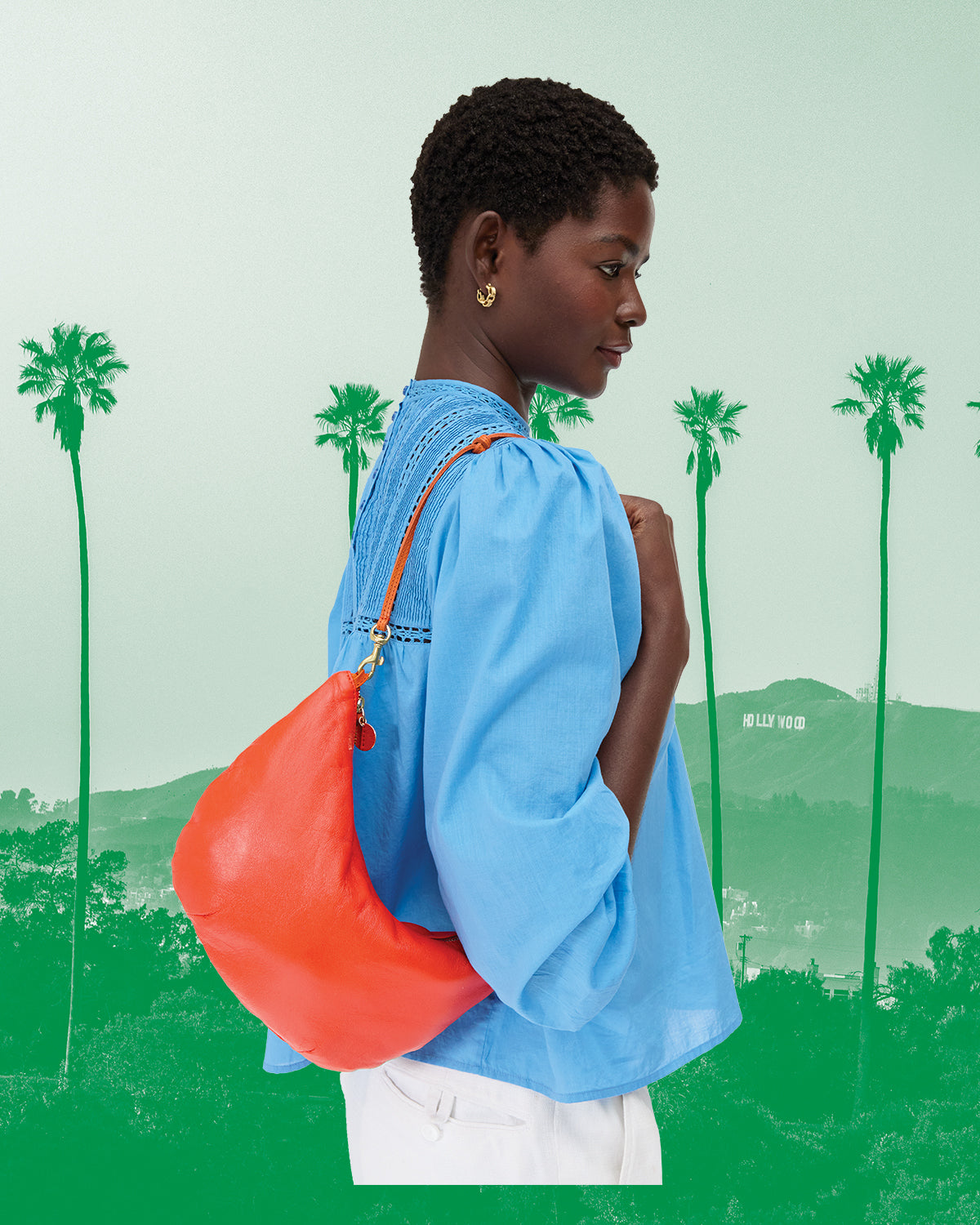 Model carrying the L'Orange Lune over her shoulder. 