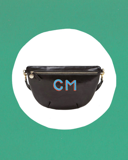 Black Grande Fanny with the letters C and M handpainted on it in blue with red shadow letters.