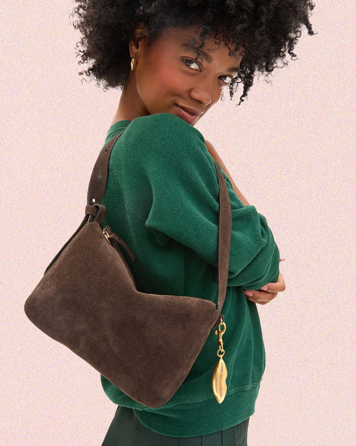 Model carrying the Chocolate Fleurine with Surrealisme Lips Fob.