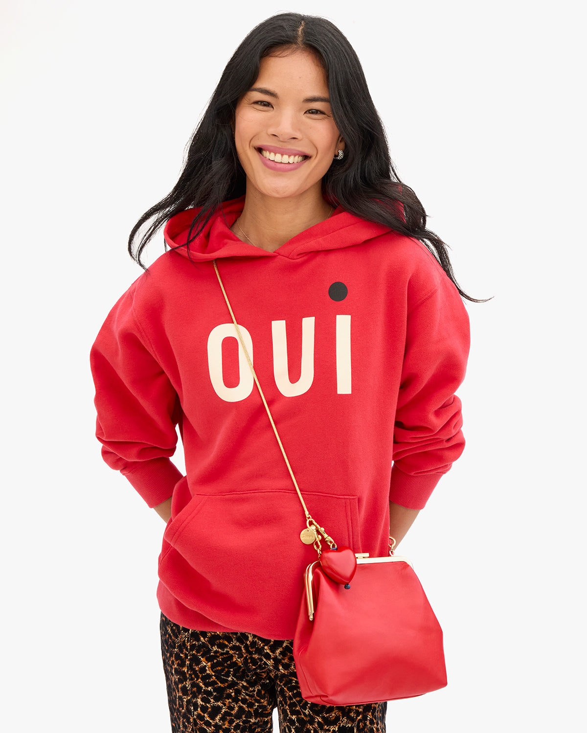 Model wearing the CV x (RED) Hoodie and Flore. 