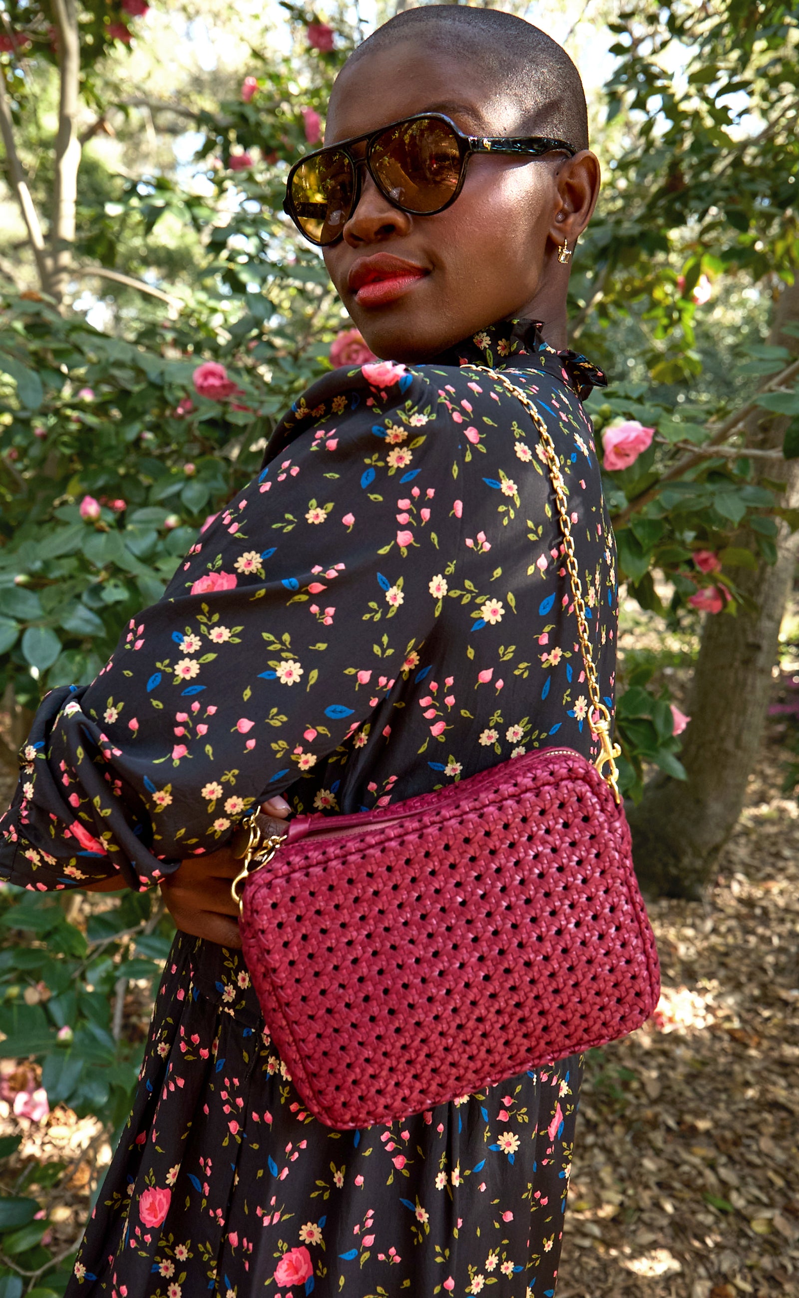 Model wearing the Plummy Rattan with Chain Shoulder Strap.