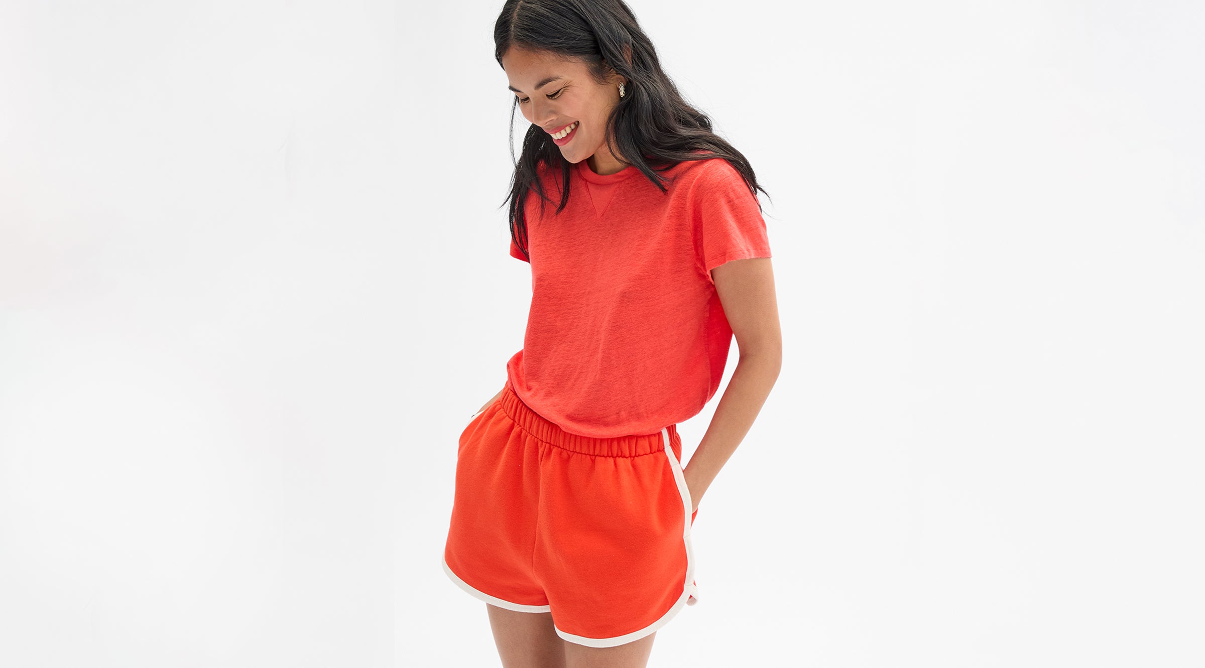 Model wearing the Bright Poppy Classic Tee with L'Orange Jogging Short. 