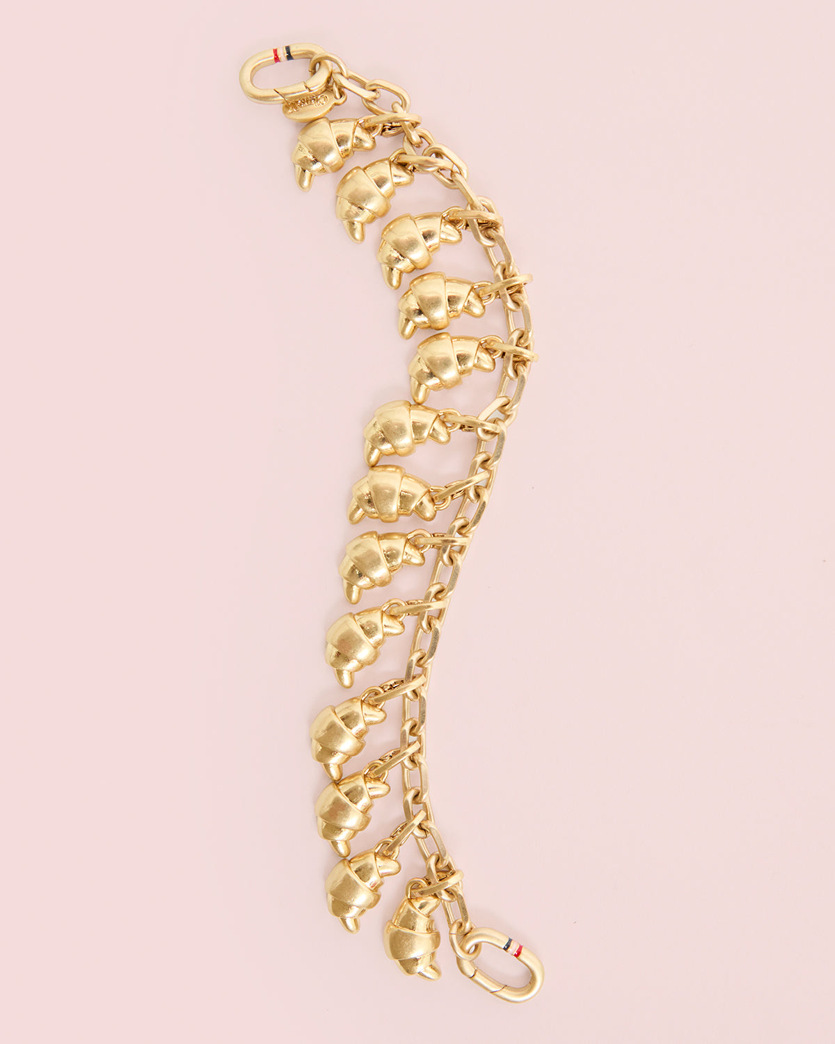 Charm Bracelet with 13 Croissant Charms attached to it. 