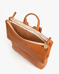 interior shot of unlined cuoio perf pocket on the agnes backpack