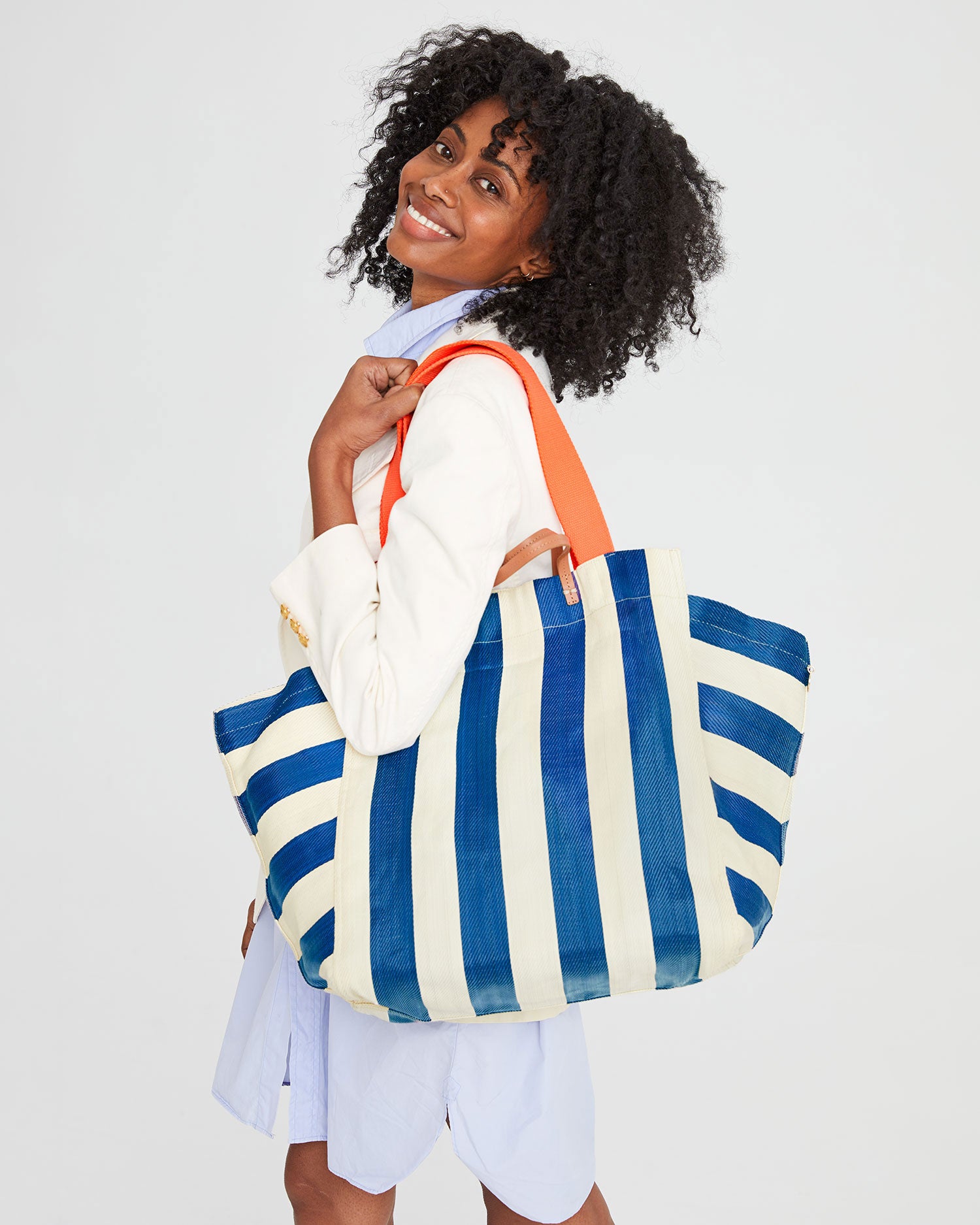 Mecca smiling with the Azul & Shell Beach Tote on her shoulder