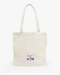 Back view of the Clare V. x Gabrielle Giffords Canvas Tote w/ Pins printed with Espoir et Courage