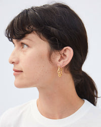 Danica Looking Off to the Side in the Vintage Gold Chain Hoop Earrings