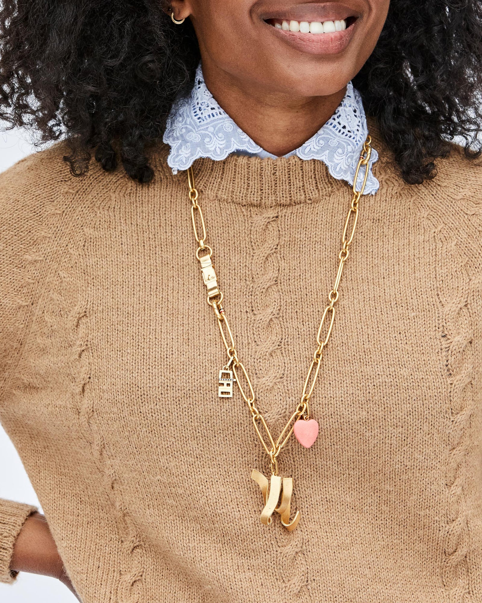 Mecca Wearing the Ciao Charm on the Convertible Chain Necklace with the Stone Heart Charm and Ribbon Letter Charm