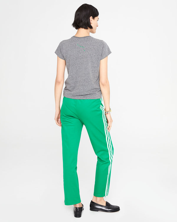 back view of  athena in the Grey Liberez les Sardines Classic Tee and green pants