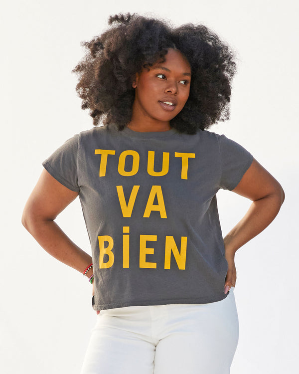 candice wearing the faded black with tout va bien classic tee  with white pants