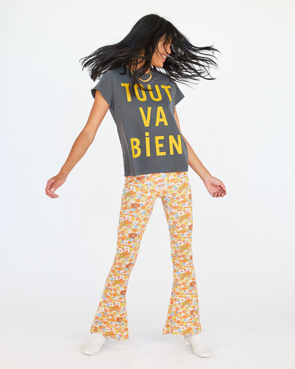 Sandra wearing the faded black with tout va bien classic tee with floral pants