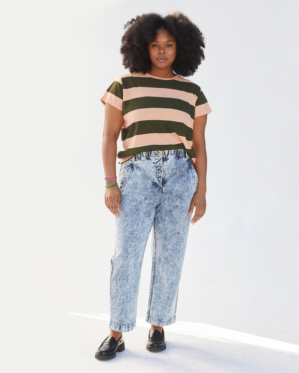 candice wearing the army and coral rugby stripe classic tee front tucked into acid wash jeans