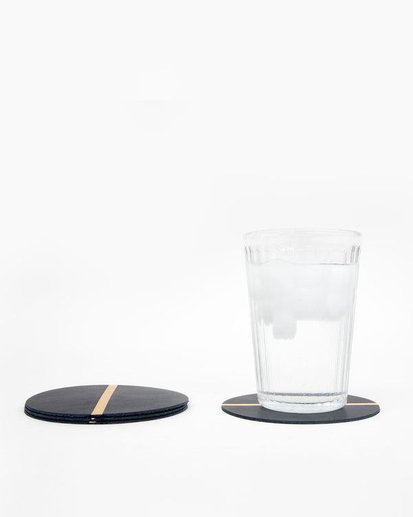 Glass of water on a Navy w/ Gold Stripe Coaster