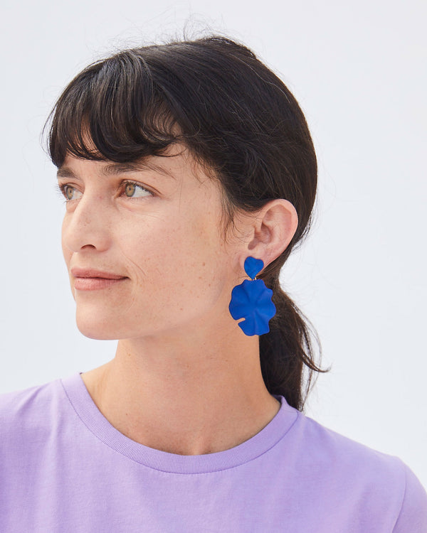 Danica Looking to her Right in a Lavender T-Shirt and the Cobalt Coated Flower Statement Earrings