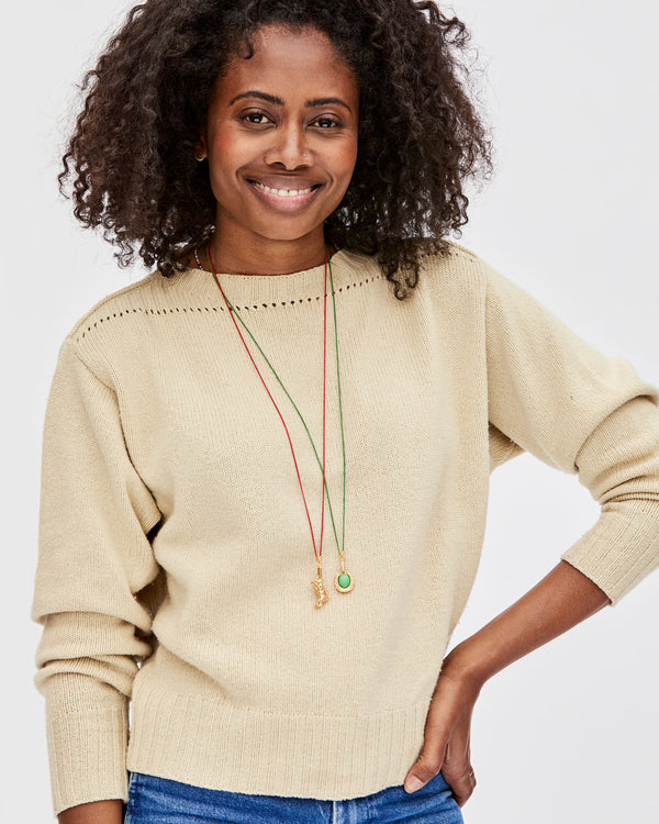 Mecca Wearing the Jumping Tiger Charm on the Poppy Coated Chain Necklace  and the Jade Horseshoe Charm on the Green Coated Chain Necklace