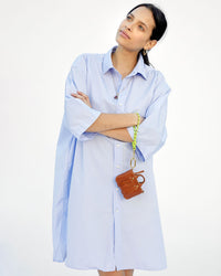 Aurelia holding the miel trop bebe by the Neon Yellow Sailcord Cord Wristlet