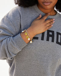 Candace wearing the Charm Chain Bracelet with assorted CV Alphabet Charms