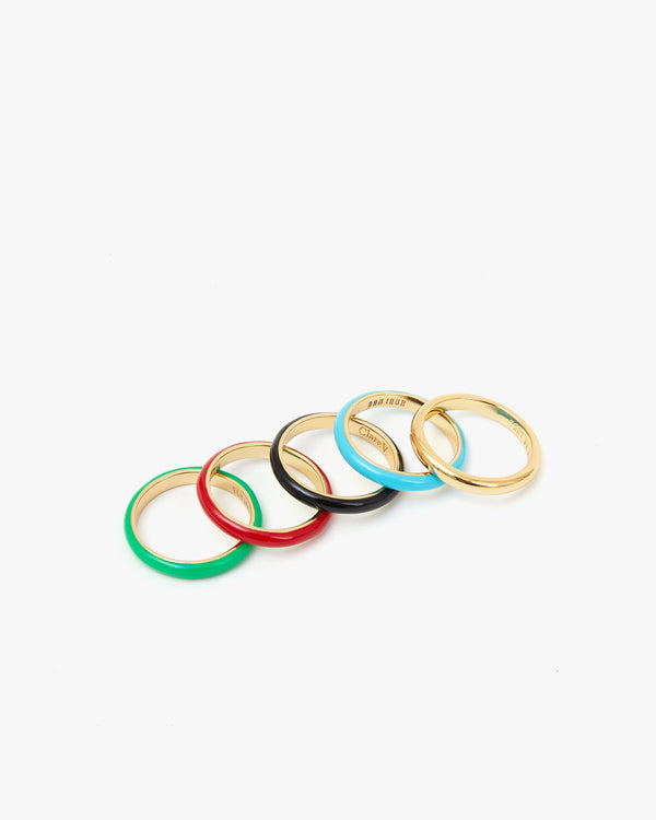 Emerald, Poppy, Black, Turquoise, and Yellow Gold Stacking Rings Spread Out Side by Side
