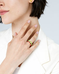 athena touching her neck while wearing 3 clare v stacking rings - including the Coral Enamel Stacking Ring