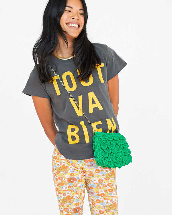 Sandra wearing the faded black with tout va bien classic tee with floral pants
