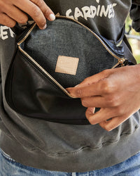 Flora Showing the Interior of the Black Velvet Fanny Pack