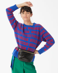 Danica wearing her the Cobalt and Poppy Discotheque Classic Sweater and the Black Croco Fannypack around her waist. 