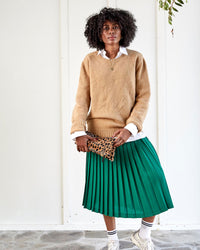 Mecca holding our Foldover Clutch in Leopard Hair