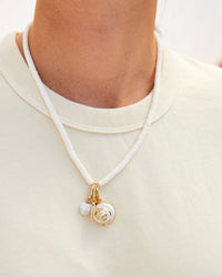 Freshwater Pearl Mini Heart Charm Shown on the Stacked Pearl Necklace with the Sardine Charm, and the Gold Dipped Shell Charm