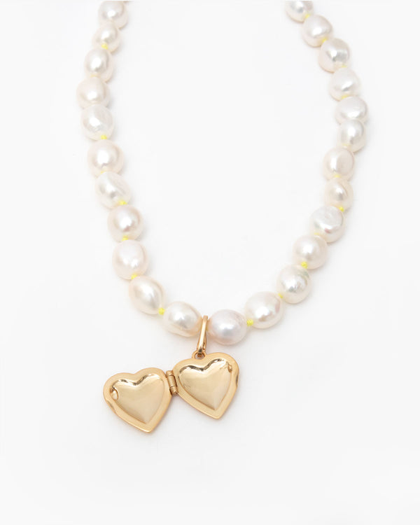  Freshwater Pearl Necklace with the Heart Locket Charm with the Locket Open Showing the Interior