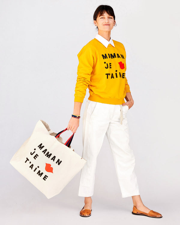 Danica Holding the Natural Maman Je T'aime Jumbo Tote  By the Top Handle