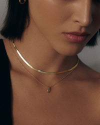 model wearing the Teardrop Necklace with a snake chain necklace