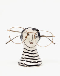 Marco Ferrini French Male Spectacles Holder with a pair of wire frame glasses 