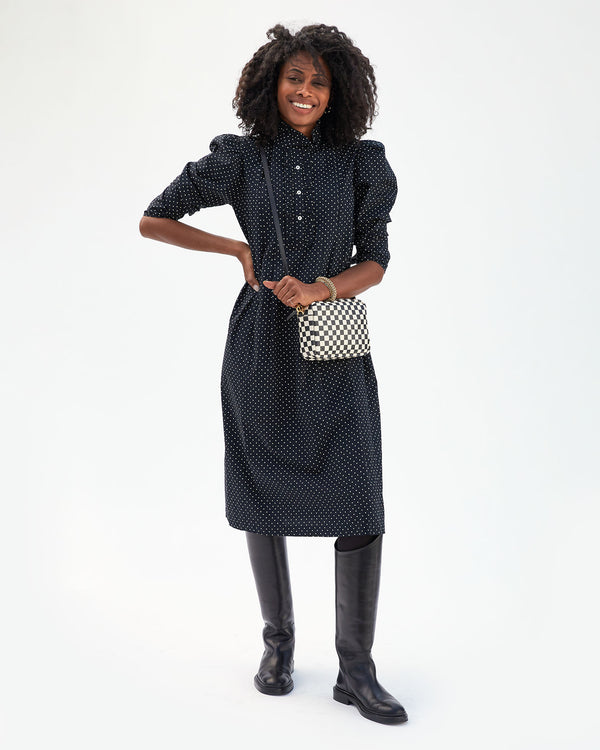Mecca wearing the Black & White Checkers Midi Sac crossbody