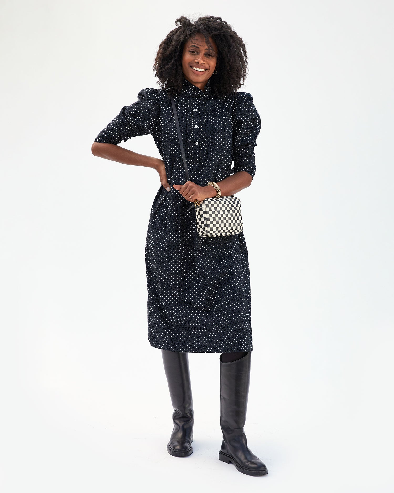 Mecca wearing the Black & White Checkers Midi Sac crossbody